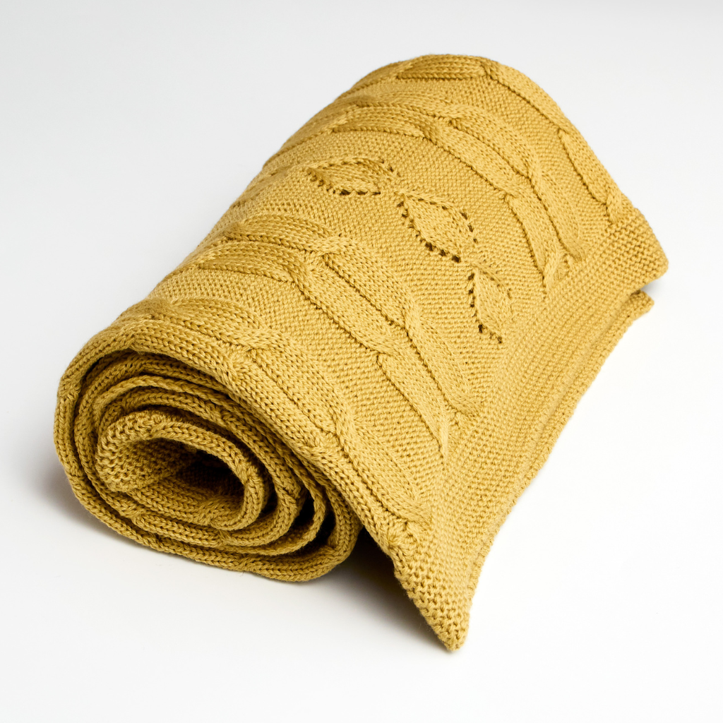 Merino Wool Cable Knit Baby Blanket mustard color rolled up