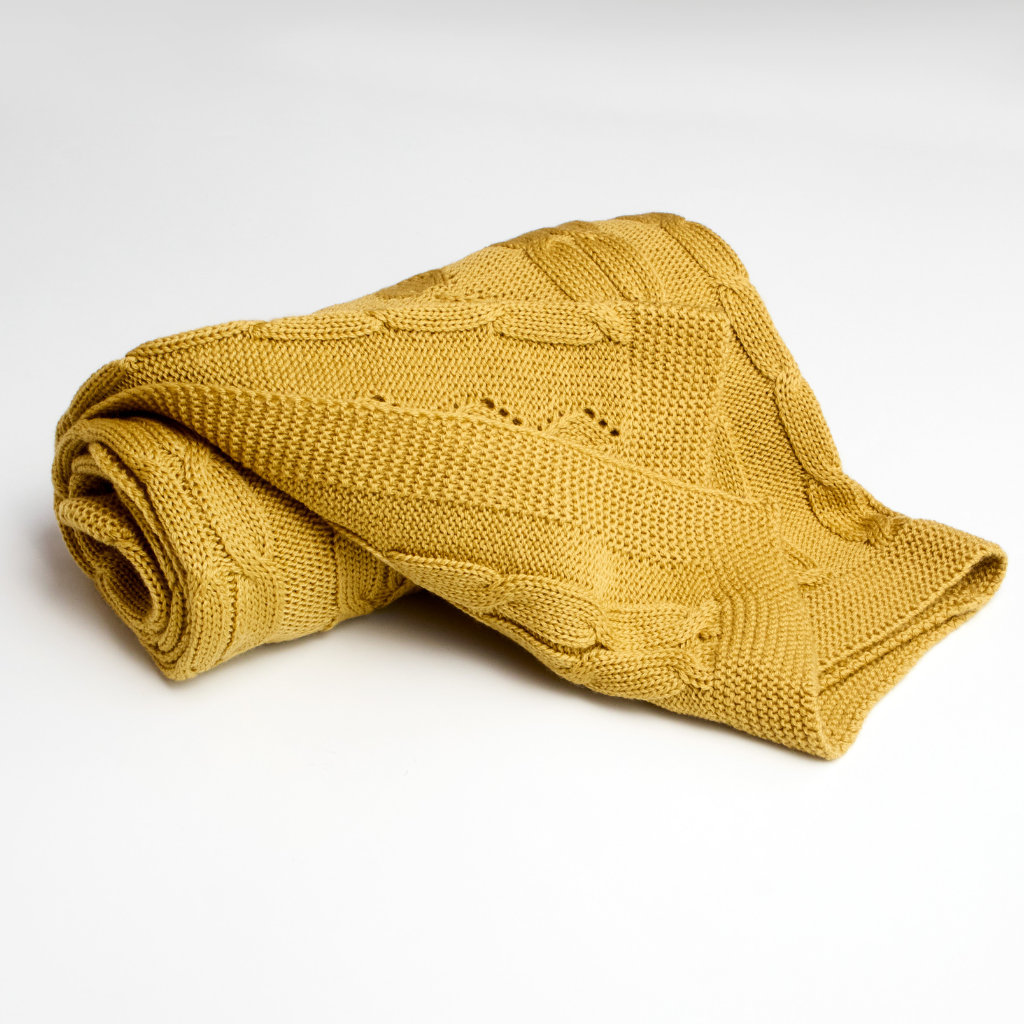 Merino Wool Cable Knit Baby Blanket mustard color rolled up